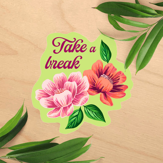 Floral design with 'Take a break' text on a wooden background